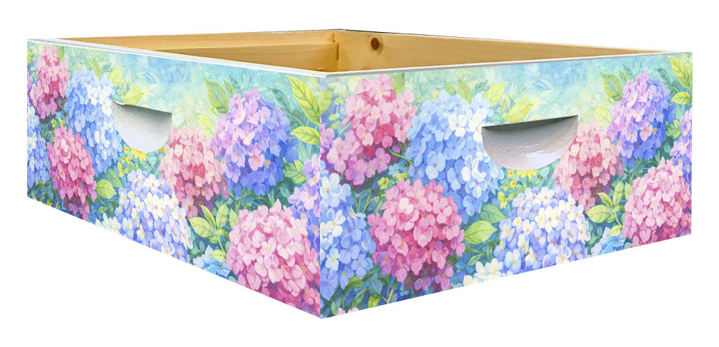 Floral-patterned bee hive box with pink and blue flowers on a white background